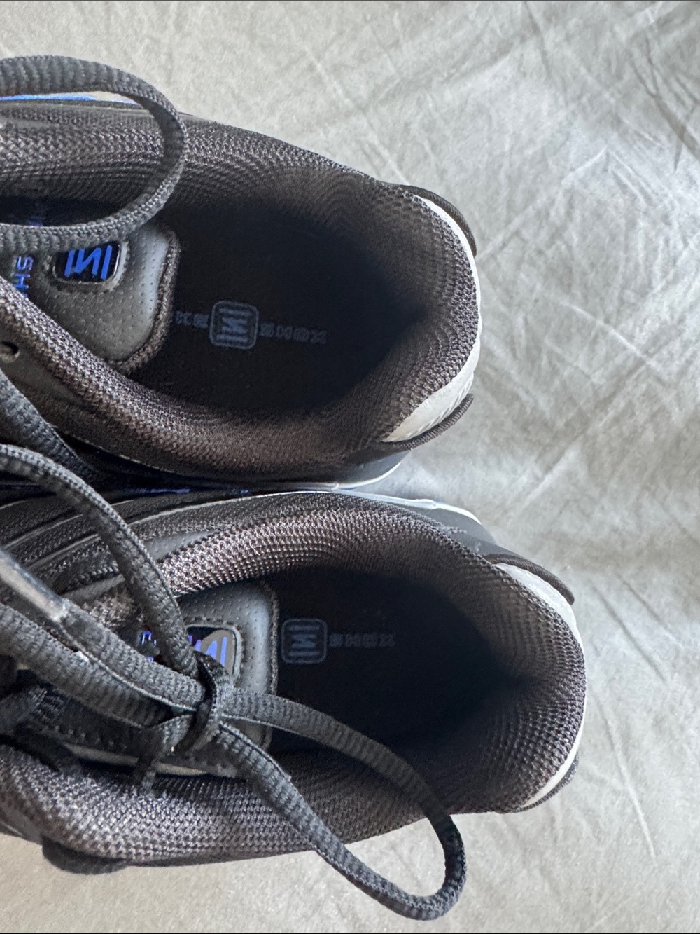 Nike Black Sneakers with Blue Accents and Cushioning Pods - Picture 4 of 8